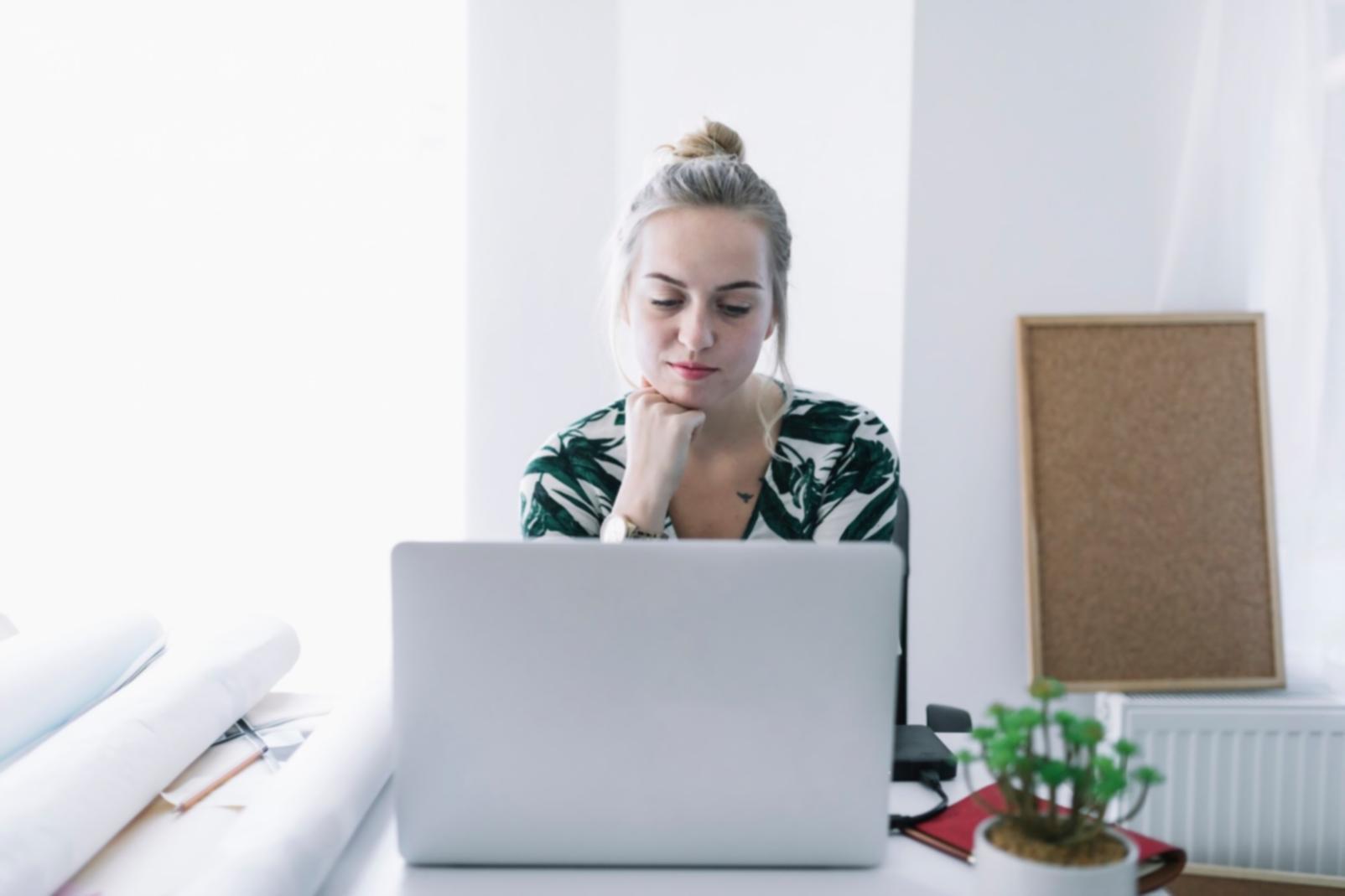 Financial planning workspace showing strategic business documents and analysis materials